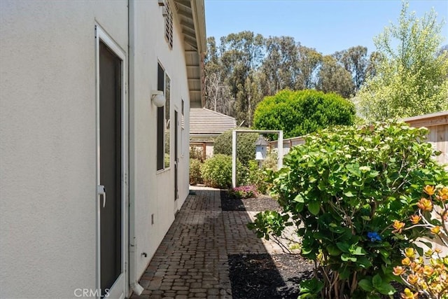 2331 Humboldt St, Los Osos, CA 93402 - view of side of home with a patio and stucco siding