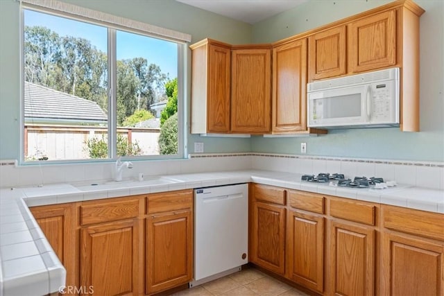 2331 Humboldt St, Los Osos, CA 93402 - kitchen with white appliances, a sink, and light tile patterned flooring