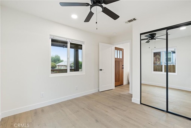 unfurnished bedroom with light wood-type flooring and baseboards