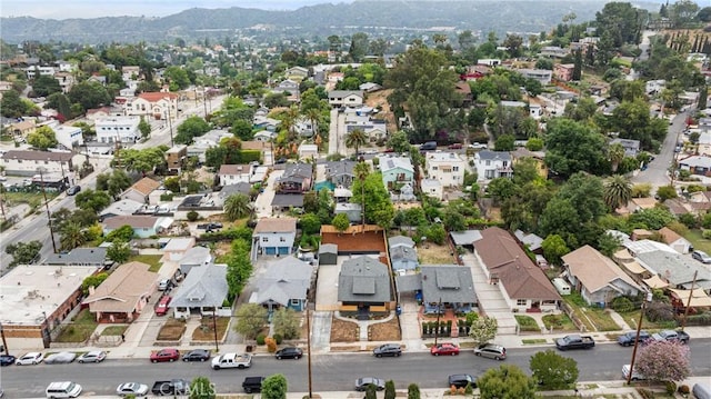 drone / aerial view featuring a mountain view and a residential view