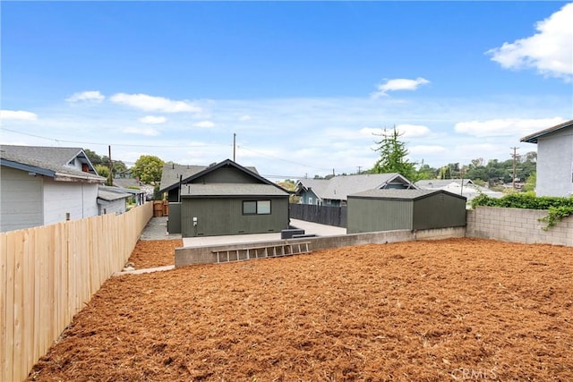 6123 Tipton Way, Los Angeles, CA 90042 - rear view of property with a fenced backyard and a residential view