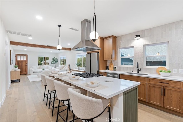 6123 Tipton Way, Los Angeles, CA 90042 - kitchen featuring a sink, island exhaust hood, appliances with stainless steel finishes, recessed lighting, and light wood-style flooring