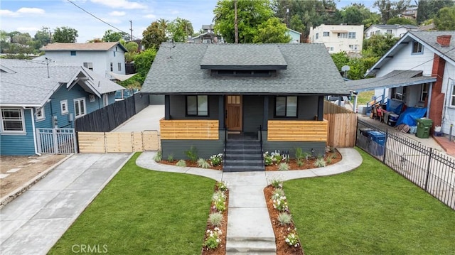 6123 Tipton Way, Los Angeles, CA 90042 - bungalow-style house featuring covered porch, a shingled roof, and a residential view