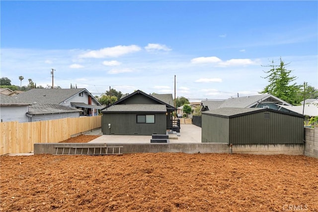 back of house with a patio area, a residential view, and a fenced backyard