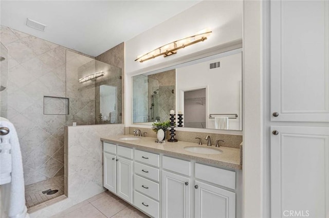 2516 Lewis Dr, Tustin, CA 92782 - bathroom with tiled shower, double vanity, and tile patterned flooring