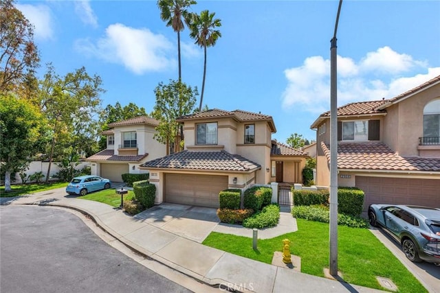2516 Lewis Dr, Tustin, CA 92782 - view of front of home with stucco siding, an attached garage, driveway, and a tile roof