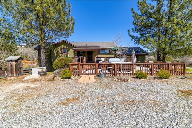 back of property with a deck