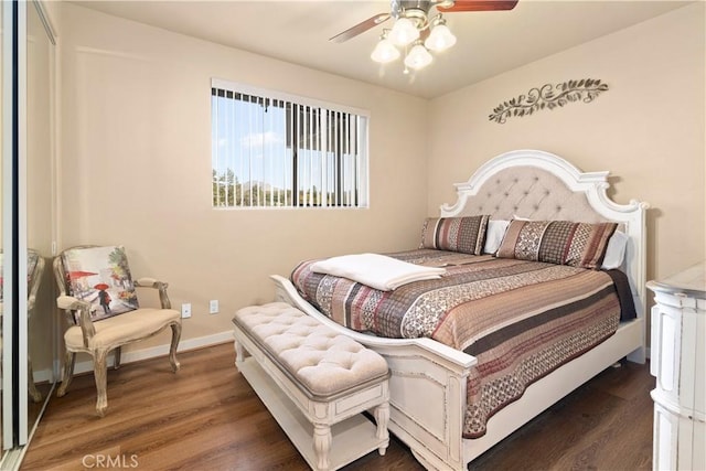 bedroom with ceiling fan, baseboards, and wood finished floors