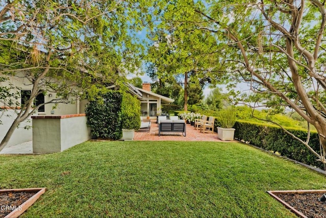 view of yard with an outdoor hangout area and a patio