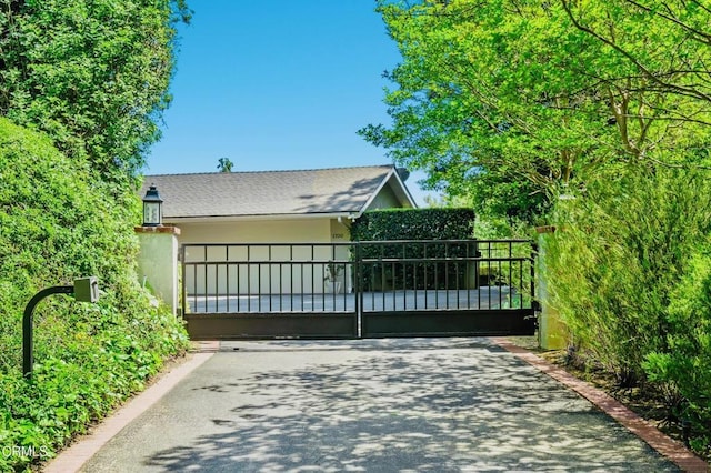 view of gate with fence