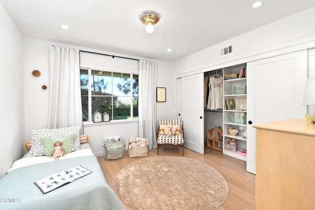 bedroom featuring recessed lighting, visible vents, and wood finished floors