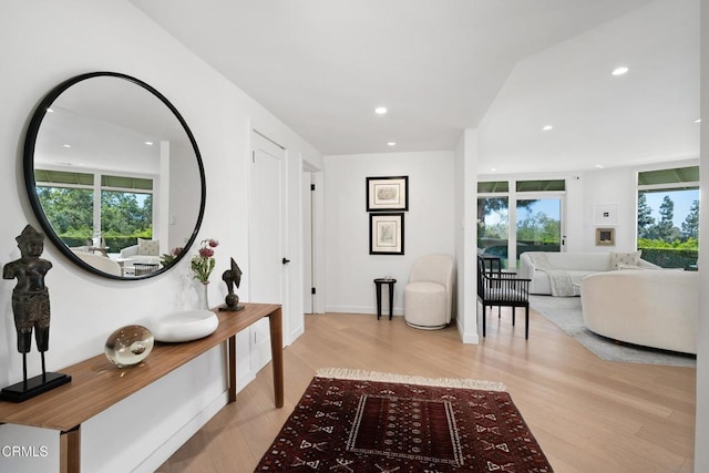 corridor featuring light wood-style floors and recessed lighting