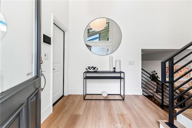 9 Jasmine Creek Dr, Corona Del Mar, CA 92625 - entrance foyer featuring stairway, light wood-style flooring, and baseboards