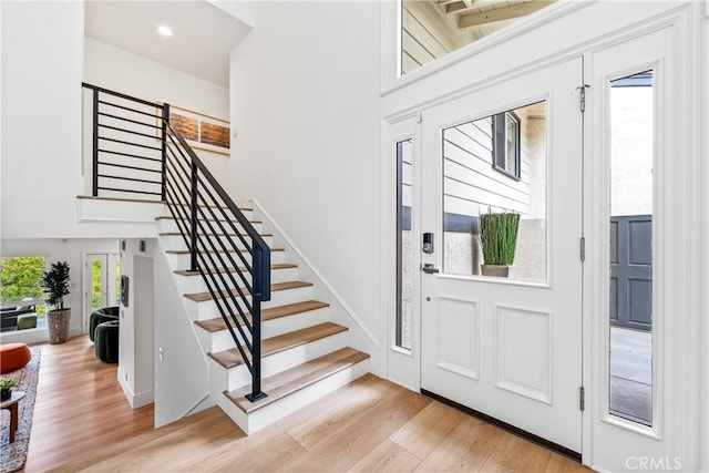 9 Jasmine Creek Dr, Corona Del Mar, CA 92625 - foyer with light wood-style flooring, stairs, a towering ceiling, and recessed lighting