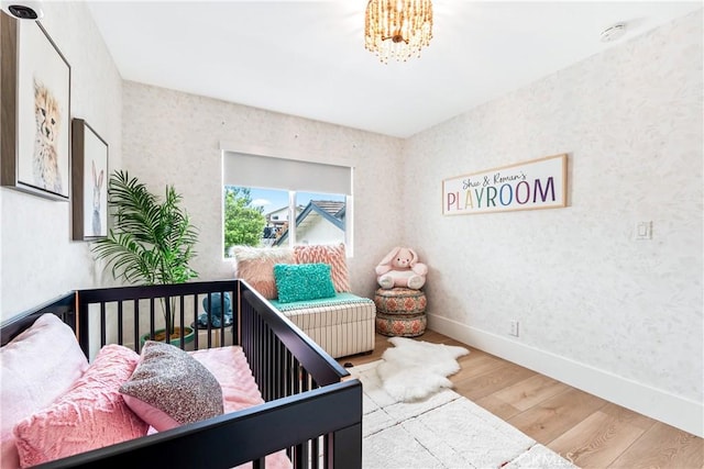 9 Jasmine Creek Dr, Corona Del Mar, CA 92625 - bedroom with wood finished floors, baseboards, and a chandelier