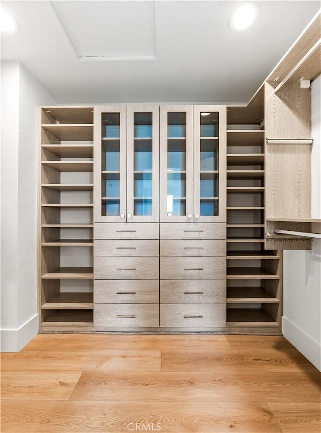9 Jasmine Creek Dr, Corona Del Mar, CA 92625 - walk in closet featuring wood finished floors