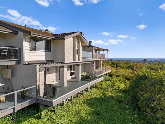 9 Jasmine Creek Dr, Corona Del Mar, CA 92625 - back of property with stucco siding and a deck