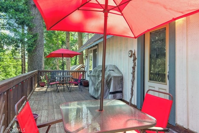 23697 Bowl Rd, Crestline, CA 92325 - wooden terrace with outdoor dining area and a grill