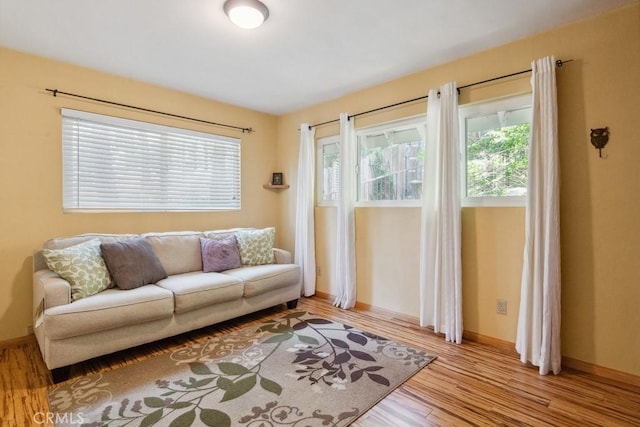 23697 Bowl Rd, Crestline, CA 92325 - living room featuring baseboards, a healthy amount of sunlight, and wood finished floors