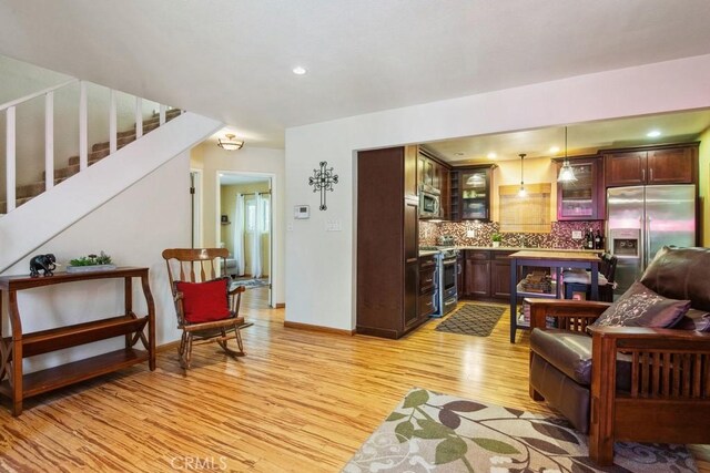 23697 Bowl Rd, Crestline, CA 92325 - living area with light wood finished floors, recessed lighting, baseboards, and stairs