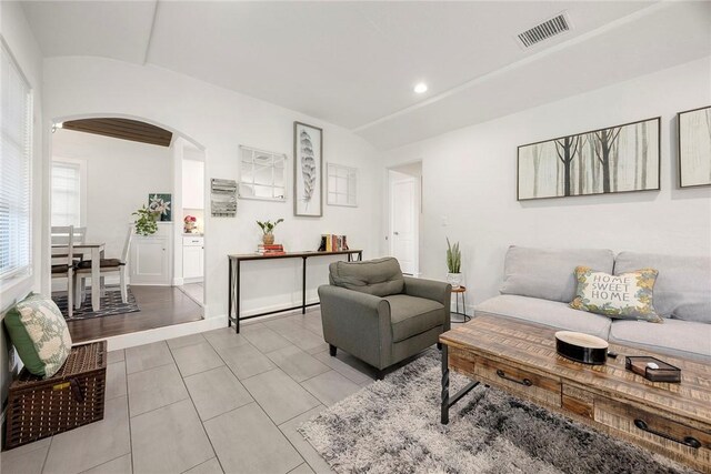 521 N Vine St, Anaheim, CA 92805 - living area featuring arched walkways, lofted ceiling, and light tile patterned floors