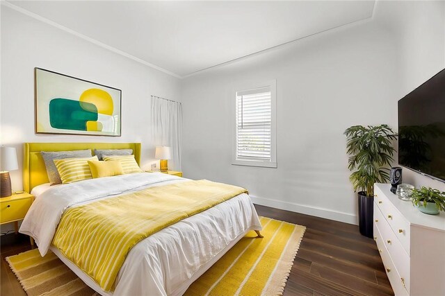 521 N Vine St, Anaheim, CA 92805 - bedroom featuring baseboards, dark wood finished floors, and crown molding