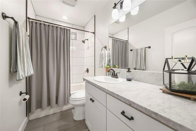 521 N Vine St, Anaheim, CA 92805 - bathroom featuring vanity, toilet, and shower / bath combination with curtain