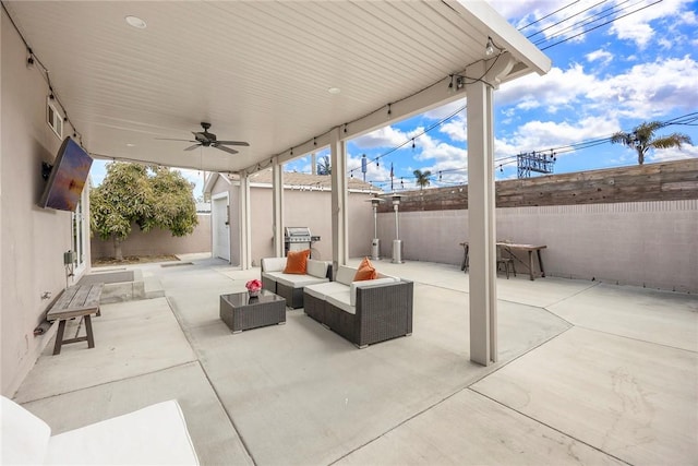 521 N Vine St, Anaheim, CA 92805 - view of patio featuring a fenced backyard, a ceiling fan, a storage shed, and an outdoor hangout area