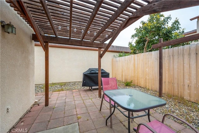 view of patio featuring a pergola, fence, and a grill
