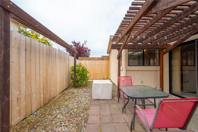 view of patio / terrace with a fenced backyard and a pergola