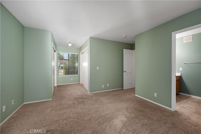 interior space featuring baseboards and visible vents