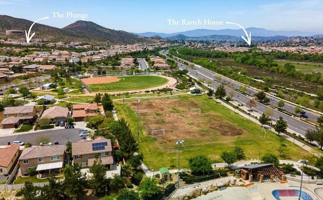 aerial perspective of suburban area with a mountainous background