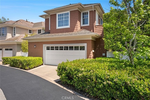view of front of home featuring concrete driveway and a garage