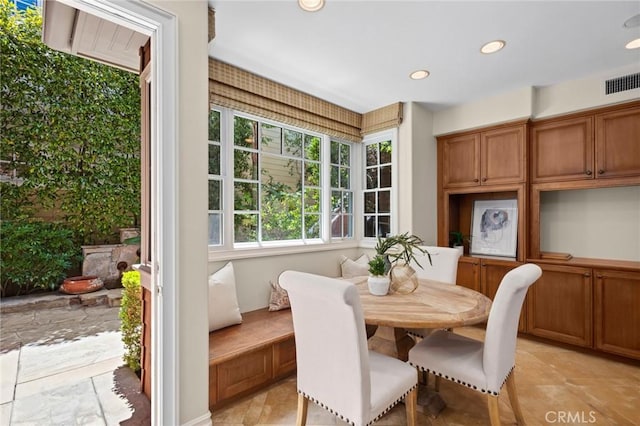 dining room with recessed lighting and visible vents