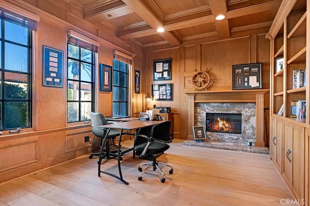office with hardwood / wood-style flooring, a high end fireplace, wooden ceiling, crown molding, and beamed ceiling