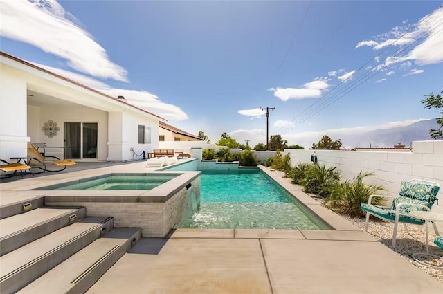 view of swimming pool featuring a patio area, an in ground hot tub, a fenced in pool, and fence