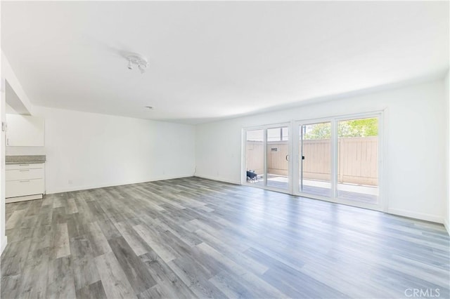 unfurnished living room with light wood finished floors