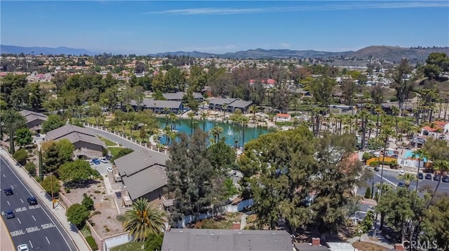 aerial view featuring a water and mountain view and a residential view
