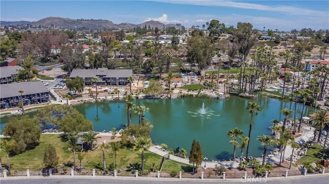 aerial view featuring a water and mountain view