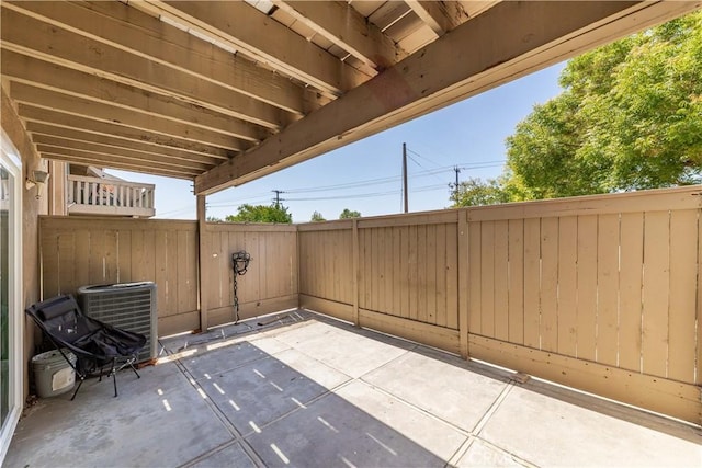 view of patio with a fenced backyard and central AC