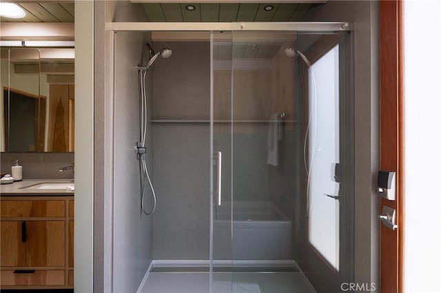 full bathroom with vanity and a shower with shower door