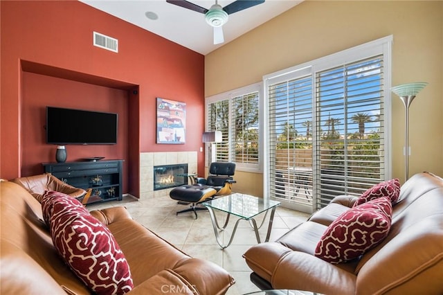 79260 Cool Reflection Ln, Quinta, CA 92253 - tiled living room featuring ceiling fan, plenty of natural light, and a tile fireplace