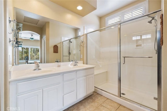 79260 Cool Reflection Ln, Quinta, CA 92253 - full bath with tile patterned flooring, a stall shower, healthy amount of natural light, double vanity, and recessed lighting