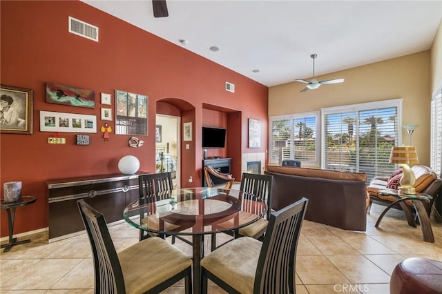 79260 Cool Reflection Ln, Quinta, CA 92253 - dining area with a ceiling fan, light tile patterned flooring, and a towering ceiling