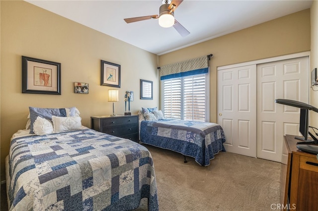 79260 Cool Reflection Ln, Quinta, CA 92253 - bedroom with light colored carpet, a closet, and a ceiling fan