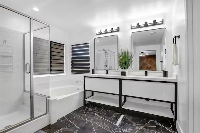 full bathroom featuring marble finish floor, visible vents, a stall shower, double vanity, and a bath