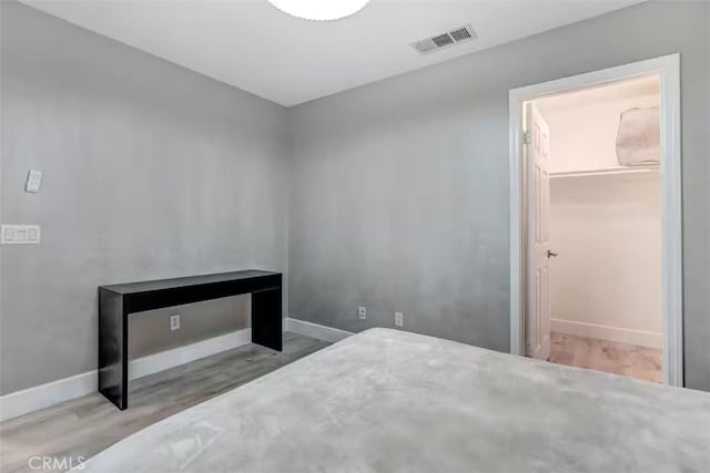 43118 Fiore St, Indio, CA 92203 - unfurnished bedroom with visible vents, wood finished floors, and baseboards