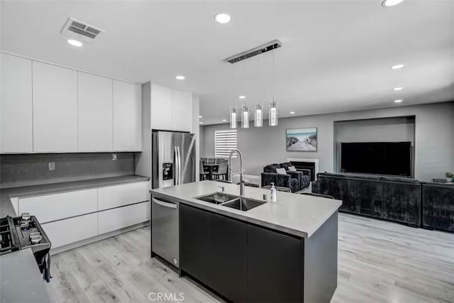 43118 Fiore St, Indio, CA 92203 - kitchen featuring a sink, appliances with stainless steel finishes, modern cabinets, and visible vents