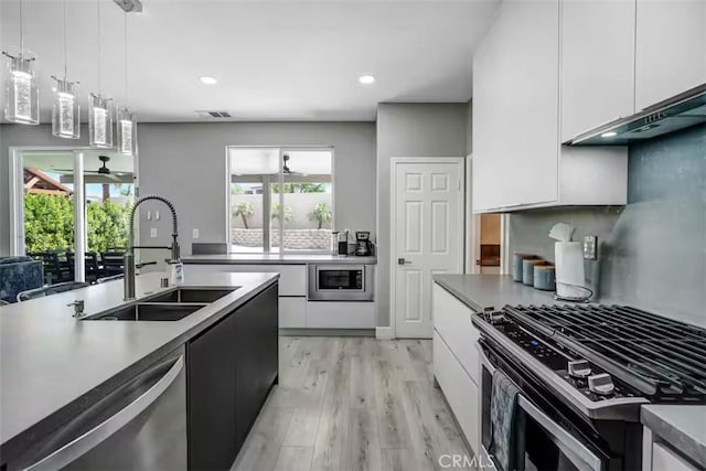 43118 Fiore St, Indio, CA 92203 - kitchen featuring a sink, stainless steel appliances, white cabinetry, and modern cabinets