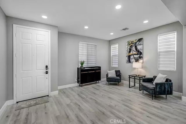 43118 Fiore St, Indio, CA 92203 - entryway with baseboards, recessed lighting, visible vents, and wood finished floors